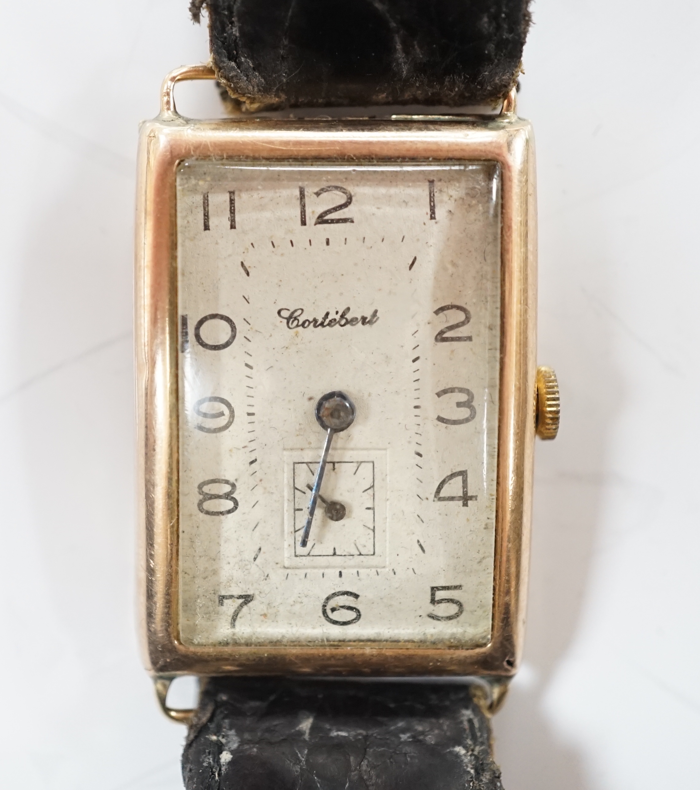 A gentleman's 1930's 9ct gold Cortebert manual wind rectangular dial wrist watch, on a leather strap.